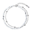 Stříbrný dvojitý náramek s bílými howlity