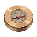 Zlacený kovový kompas